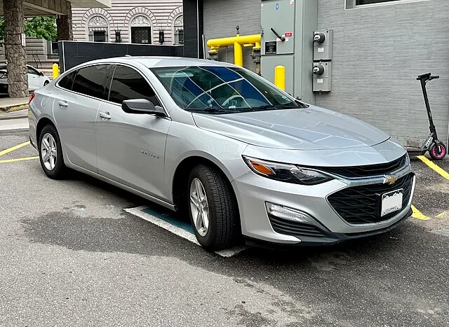 Silver 2020 Chevy Malibu parked outside