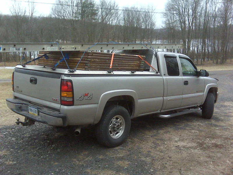 Silver GMC Sierra 3500HD towing a load