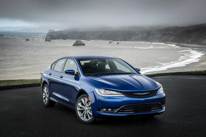 Blue 2015 Chrysler 200 on a beach