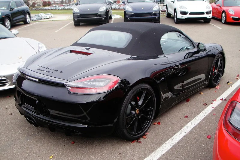 Black Porsche Boxster in a parking lot