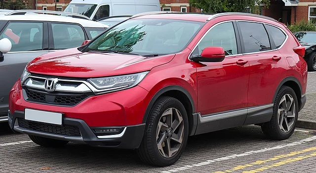 Red Honda CR-V in a lot