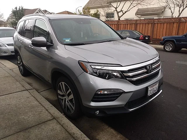 Silver 2021 Honda Pilot parked on a street