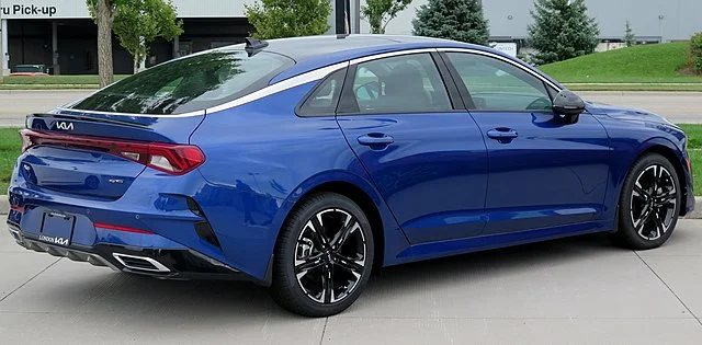 Blue 2022 Kia K5 parked outside