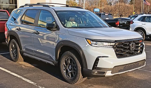 Honda Passport parked in a lot at sunset