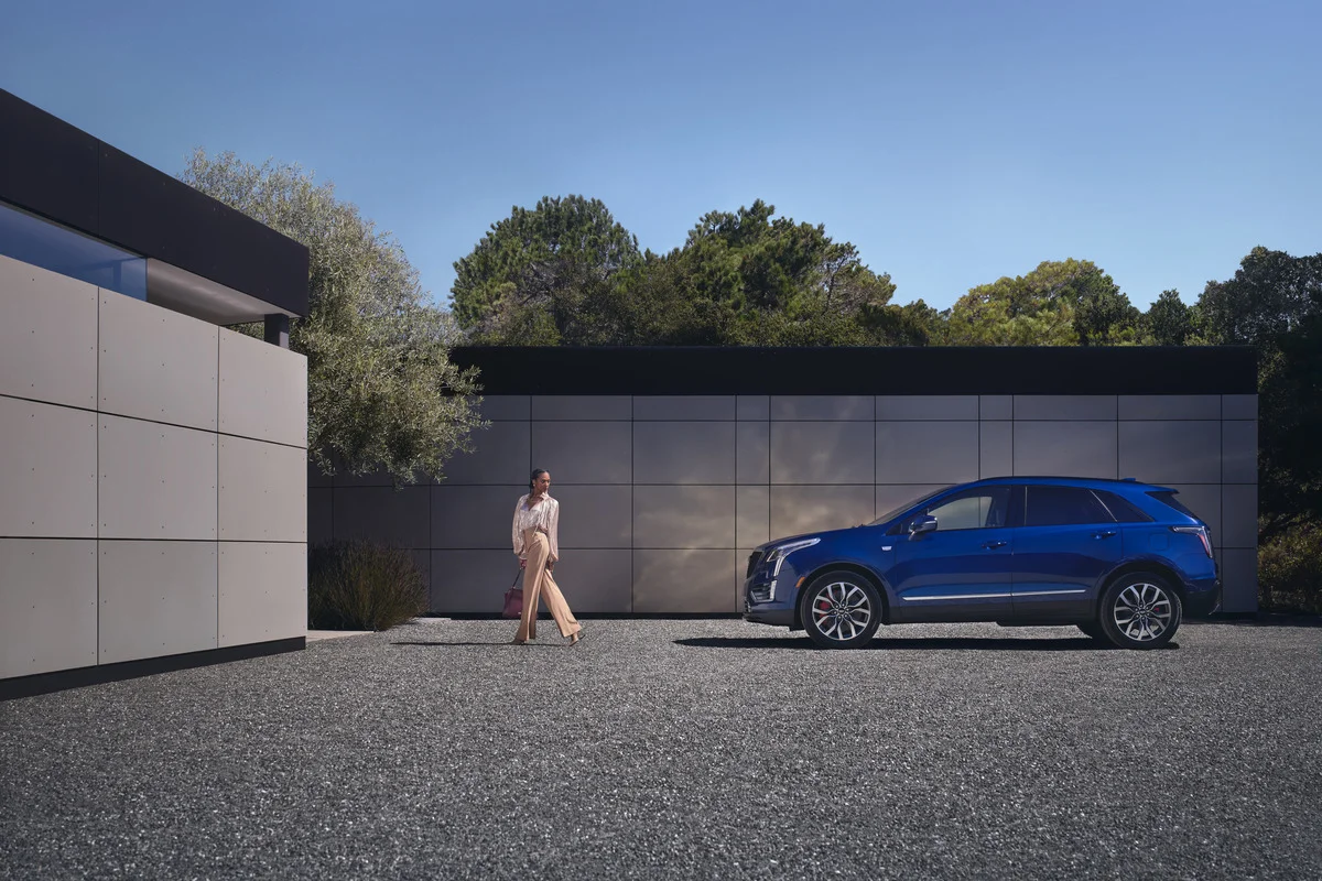 woman and blue 2024 cadillac xt5