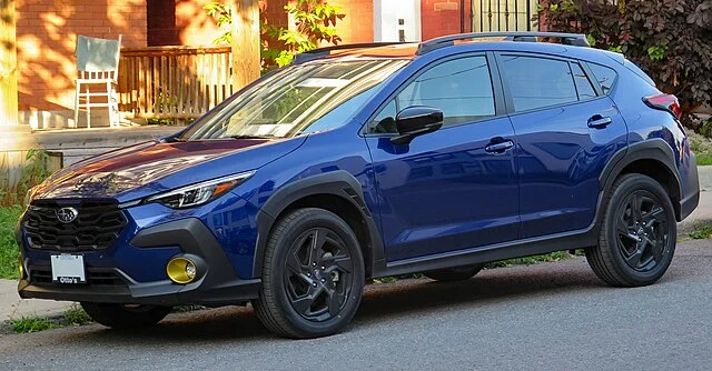 Blue 2024 Subaru Outback on a street