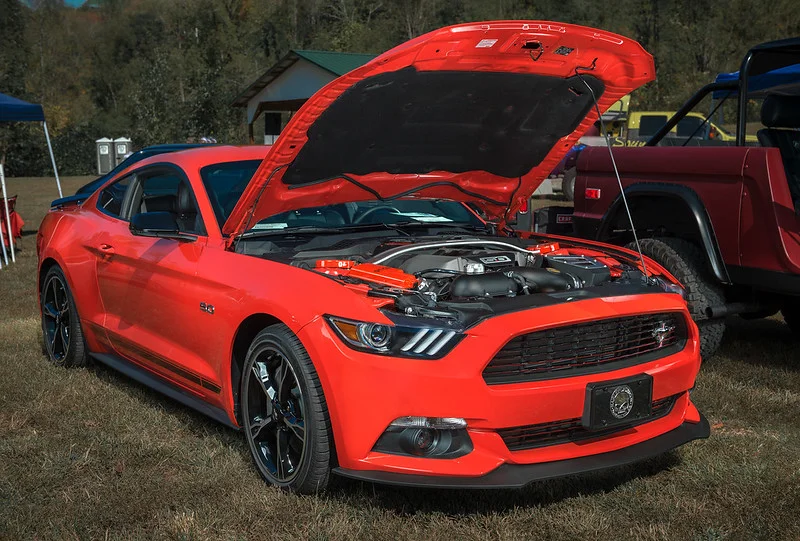 Red car with a 5.0 Coyote Engine