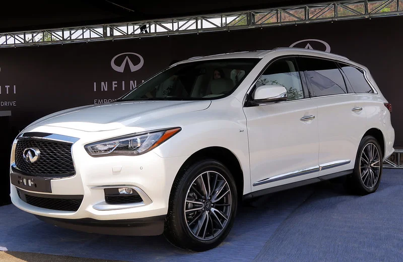 White Infiniti QX60 in a showroom