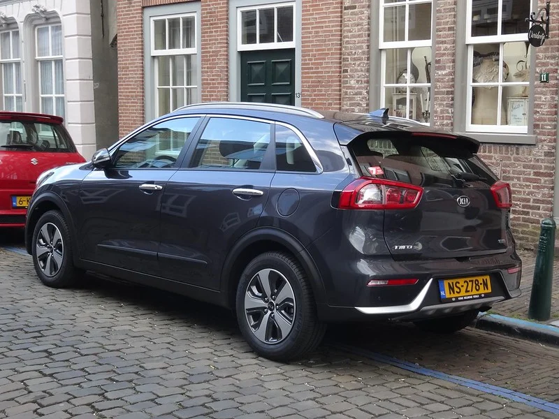 Black Kia Niro parked on a street