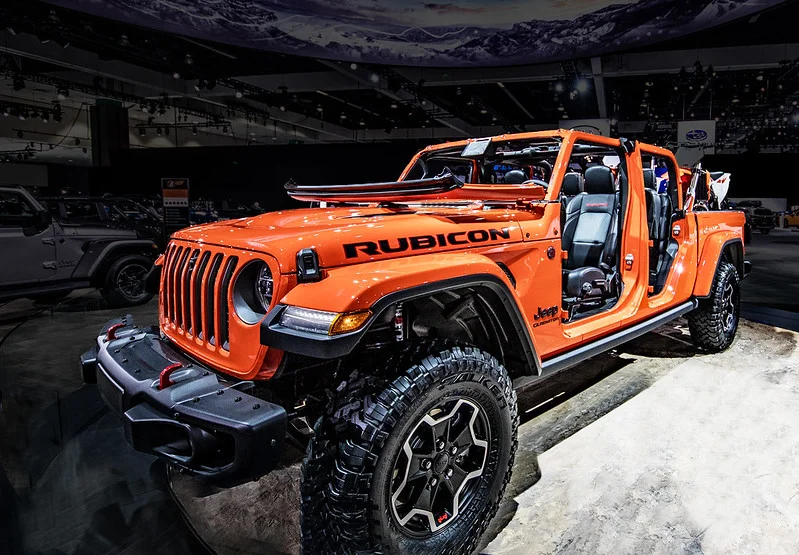 Orange Jeep Gladiator in a showroom