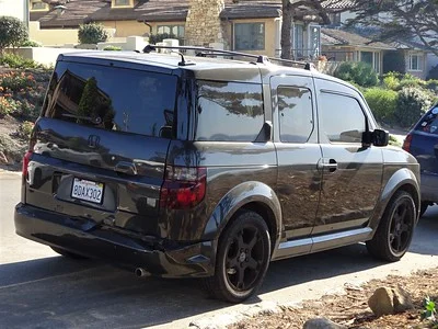 Rear view of a Honda Element parked on a street