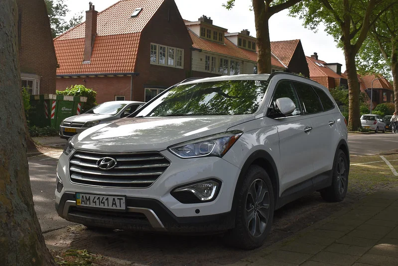 White Hyundai Santa Fe in a neighborhood