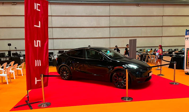 Black Tesla Model Y in a showroom