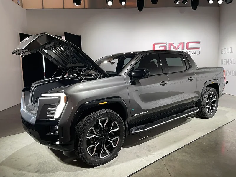 Silver GMC Sierra in a showroom