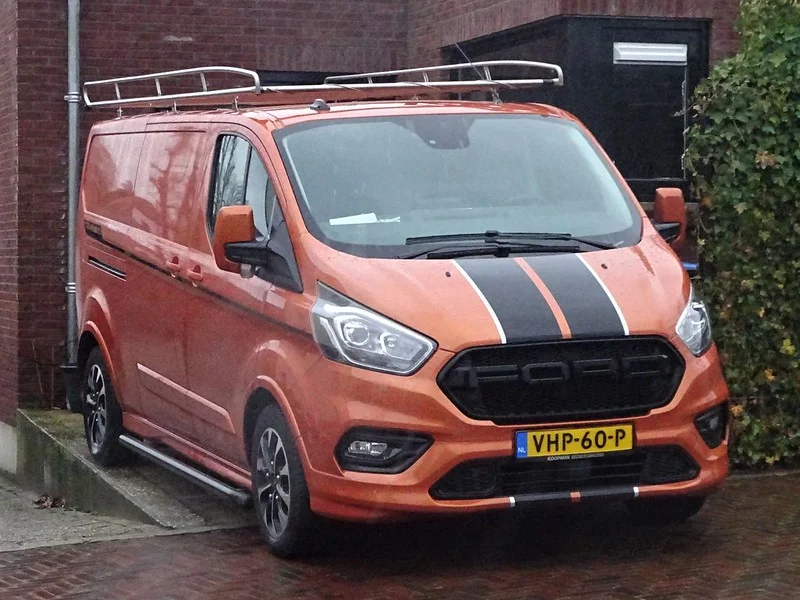 Orange Ford Transit van