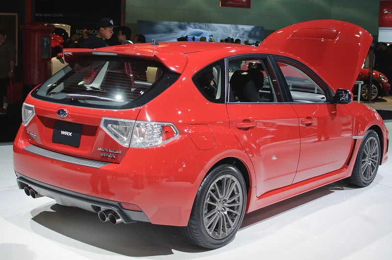 Red Subaru in a showroom