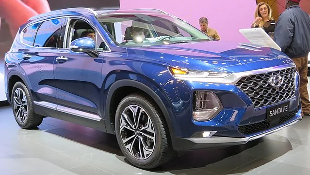 Blue Hyundai Santa Fe in a showroom