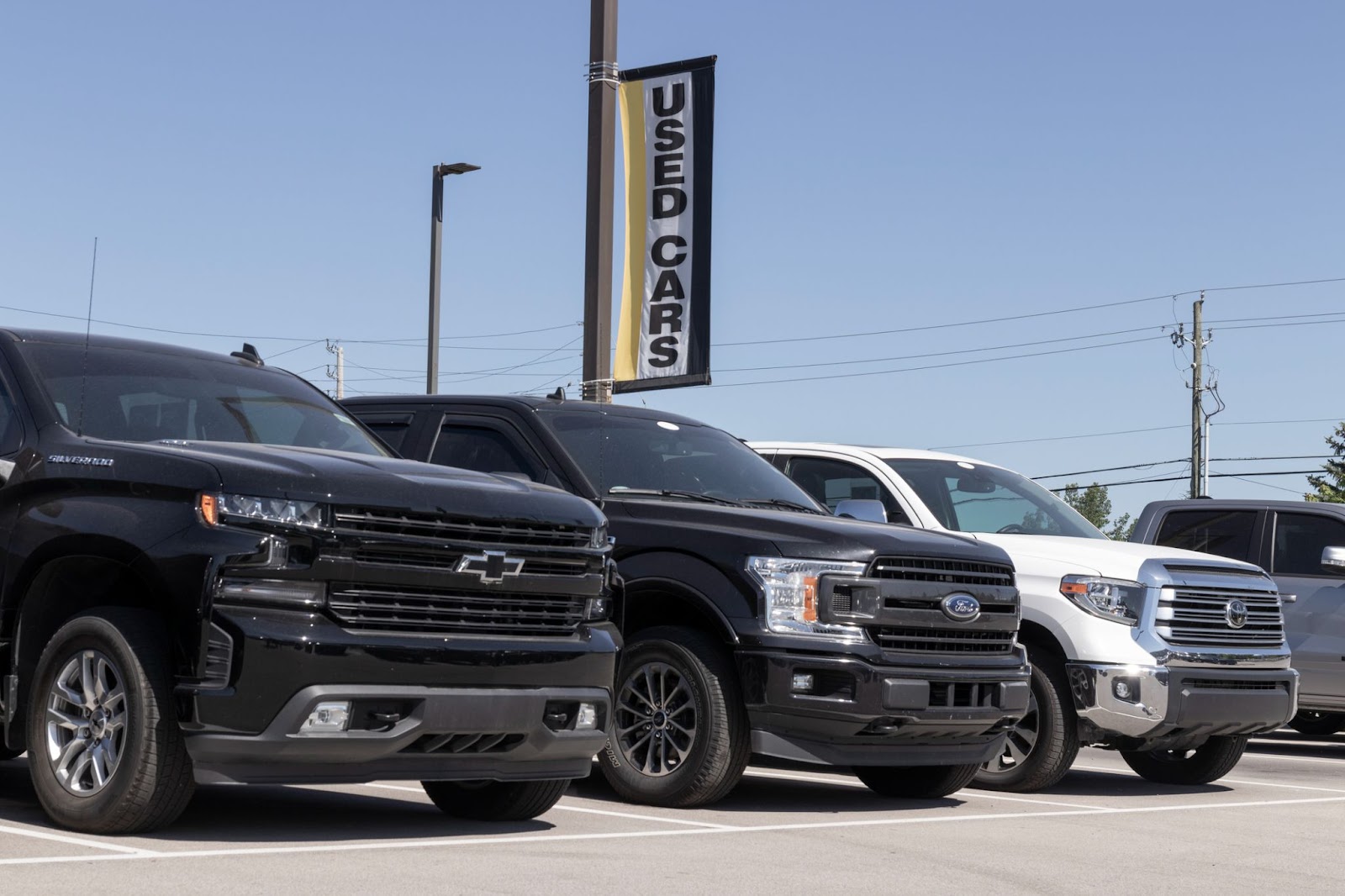 suvs and trucks sitting on a dealership lot