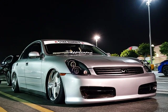 Infiniti parked on a street at night