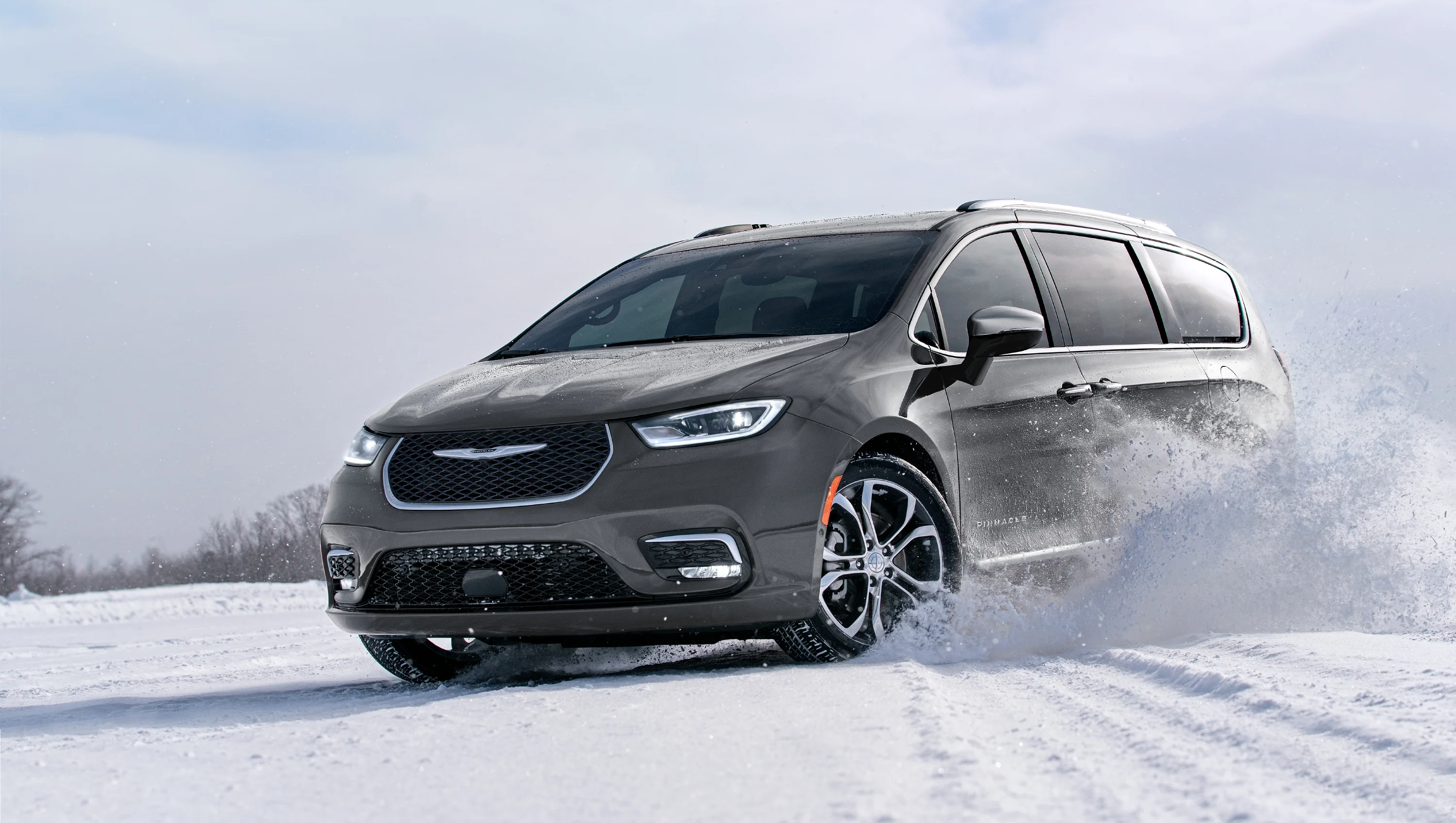 slate grey 2024 Chrysler Pacifica in the snow