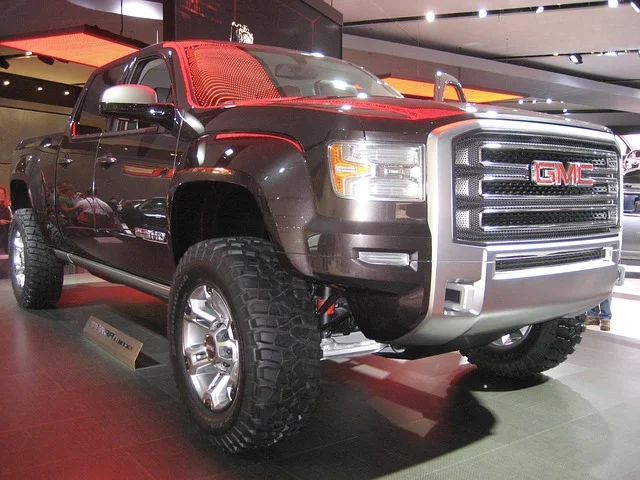 Black GMC Sierra in a showroom