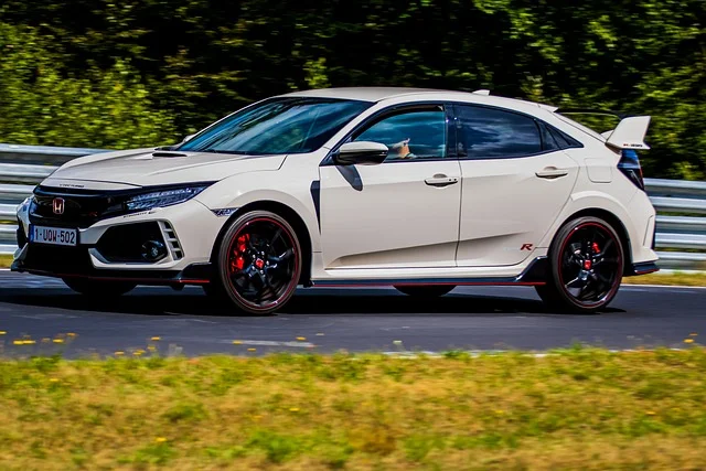 Cream Honda Civic on a racetrack