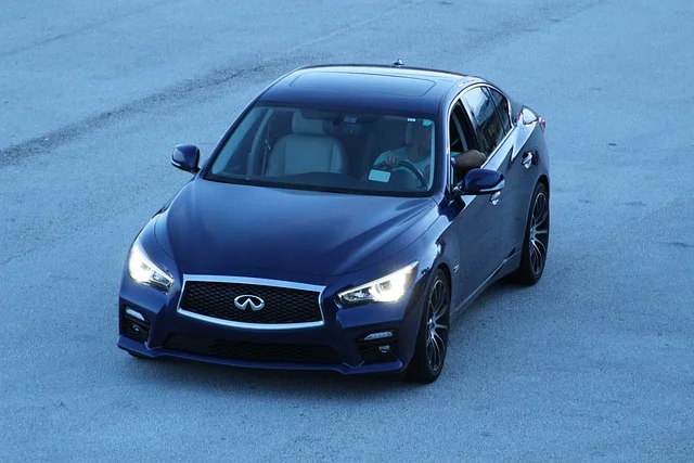 Black Infiniti Q50 driving on pavement