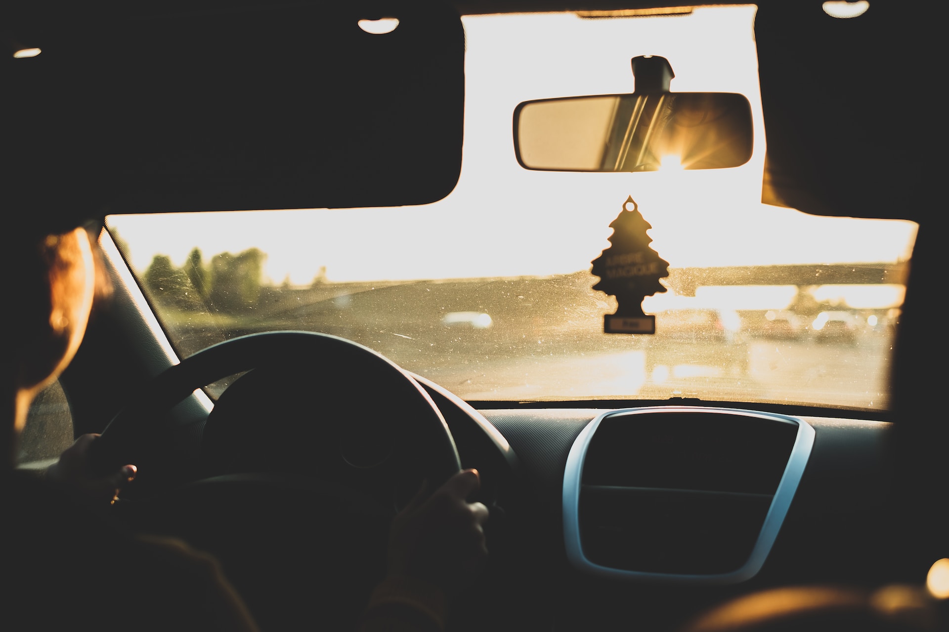 car air freshener hanging on rearview mirror