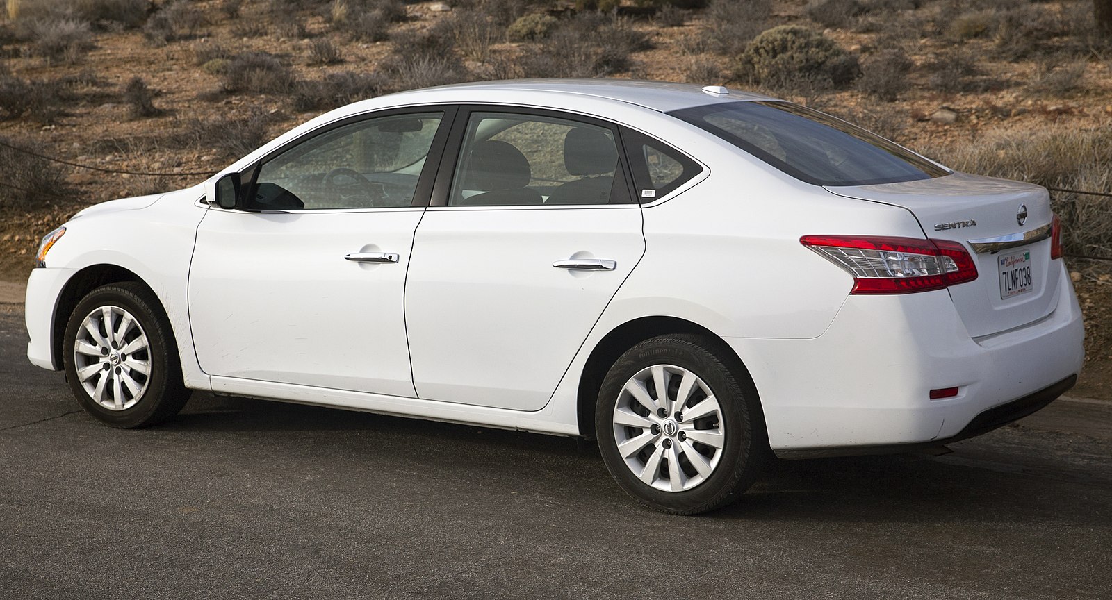 White Nissan Sentra in the desert