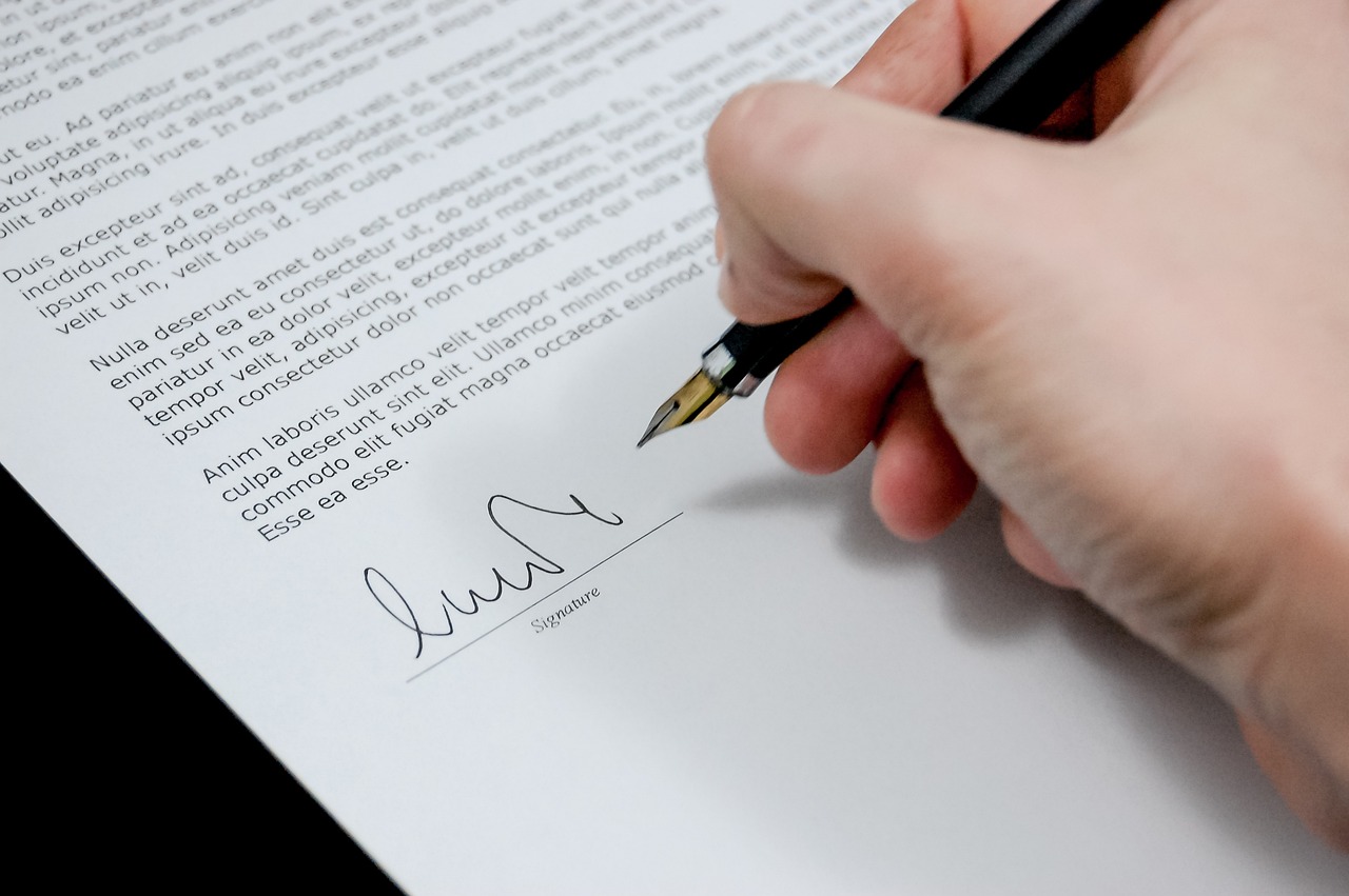 Person signing paperwork