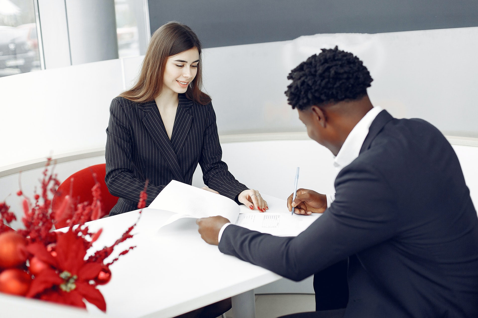 Man signing car paperwork