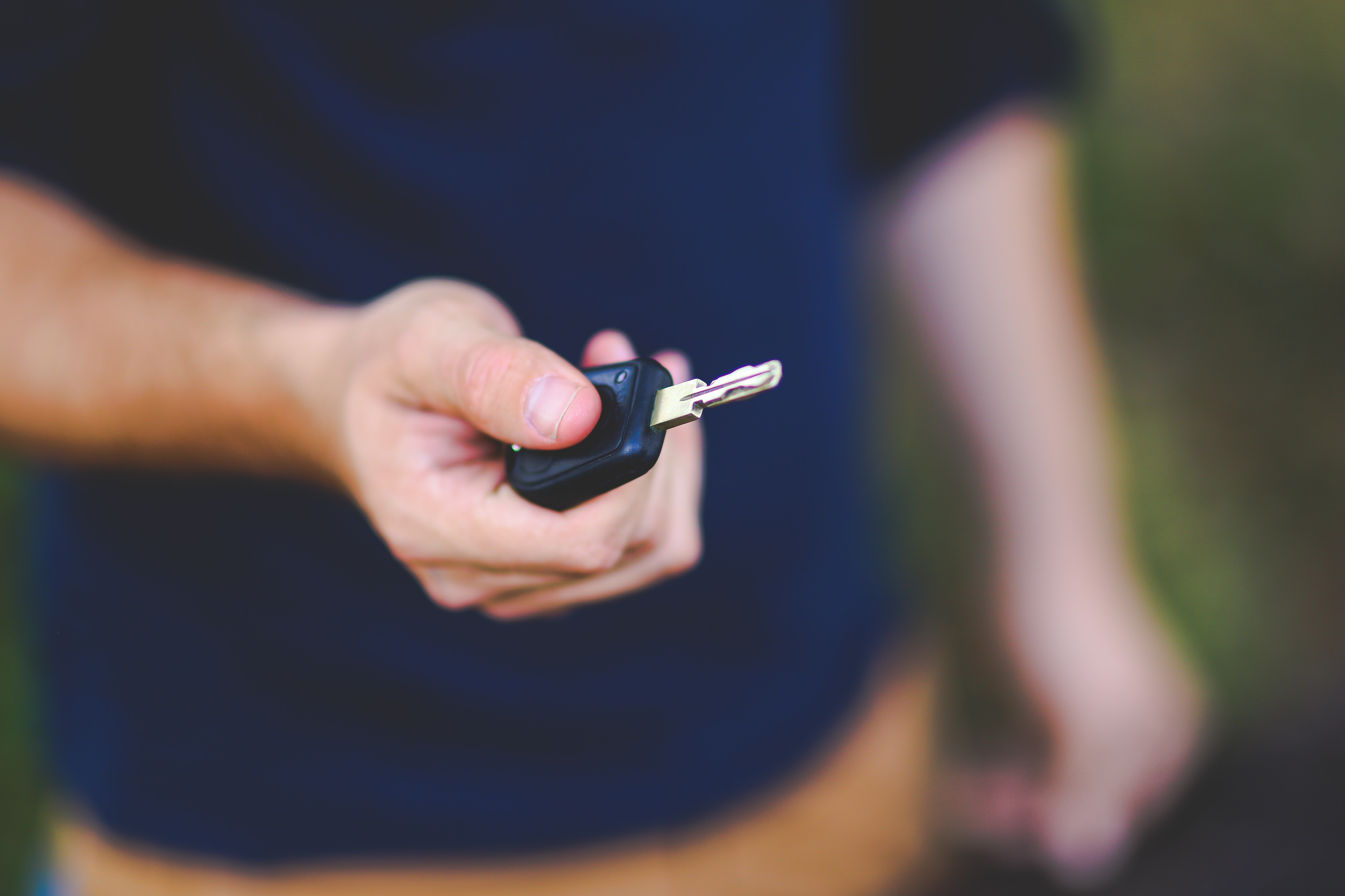 man holding car keys