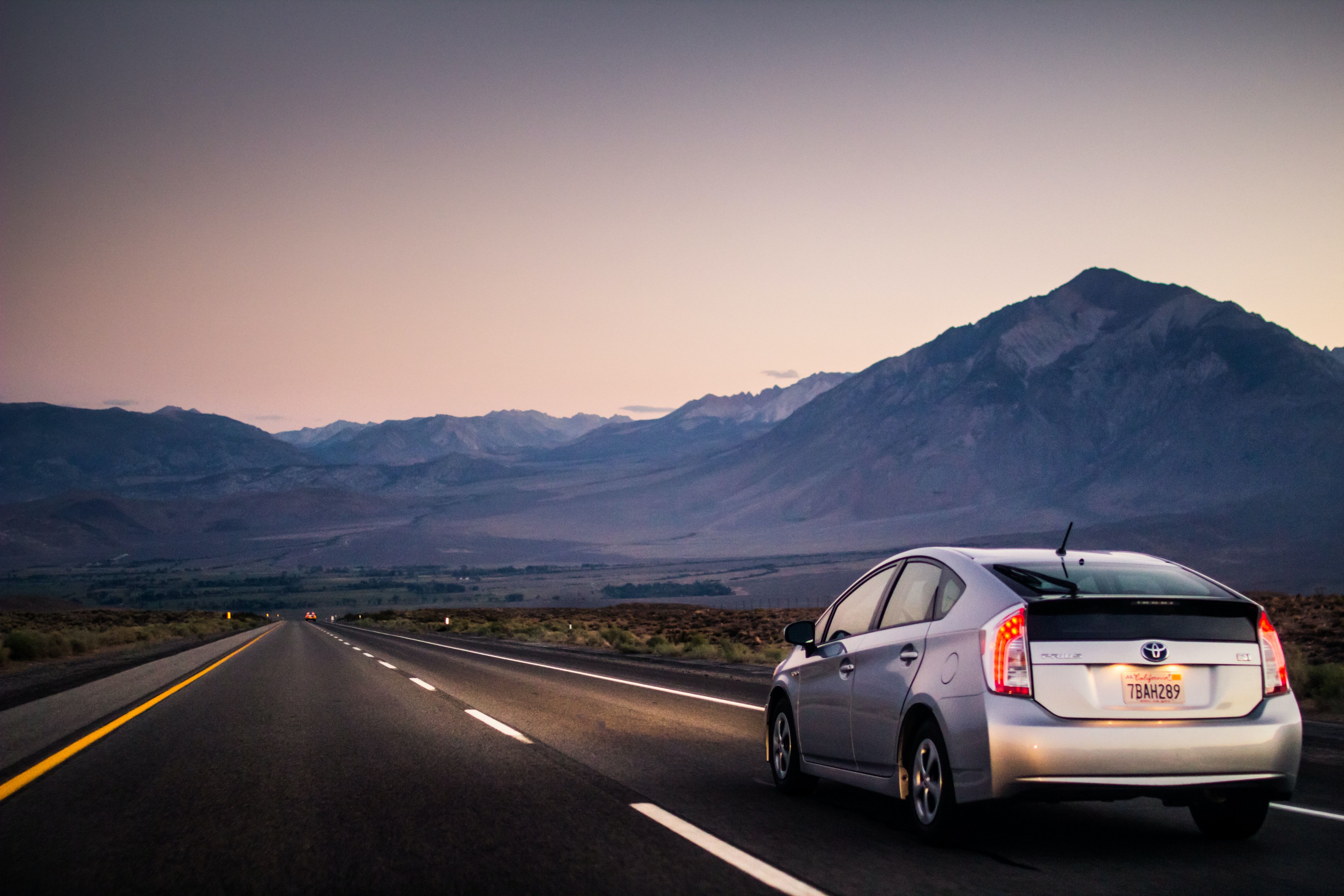 toyota driving through desert mountains