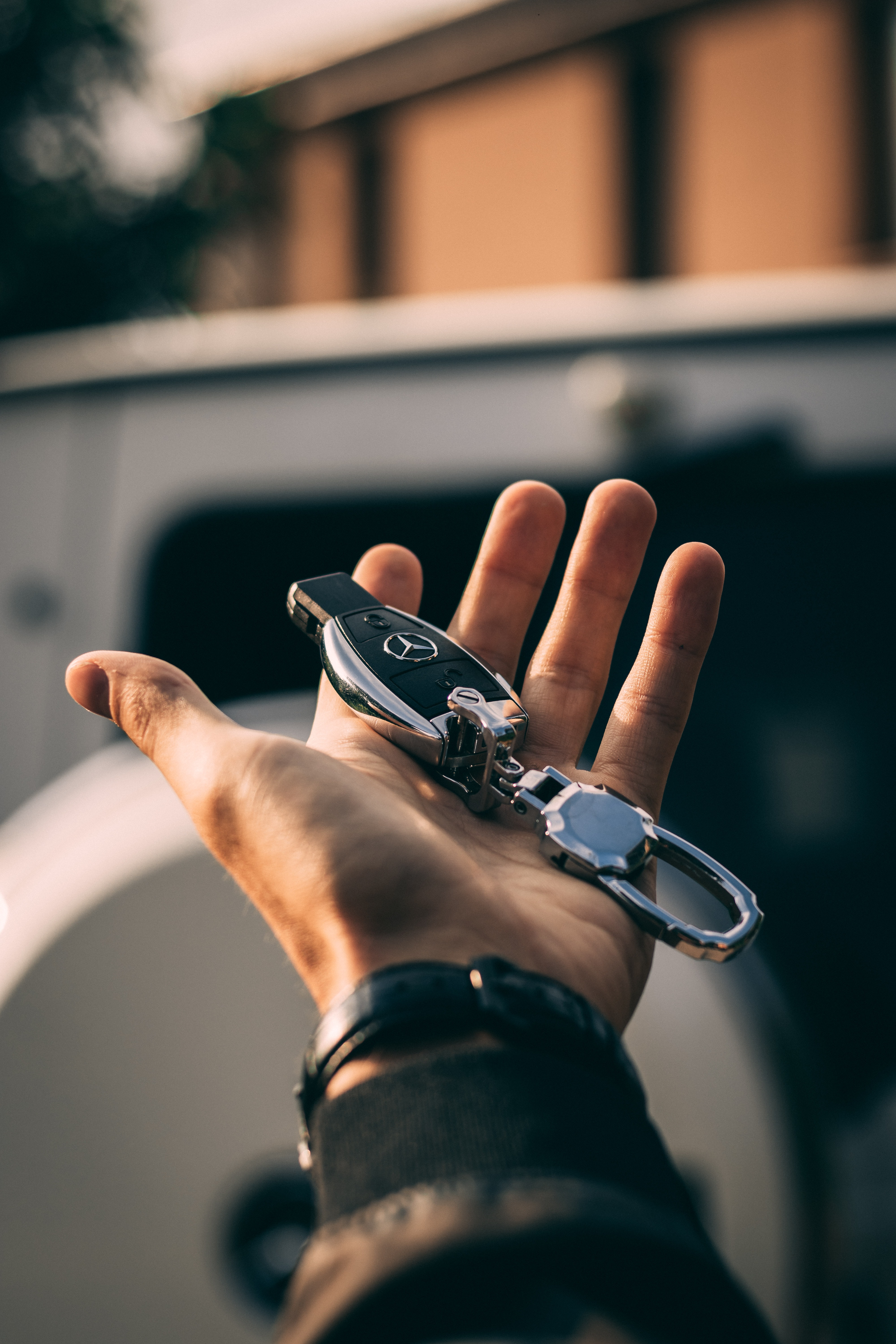 Hand holding a car key