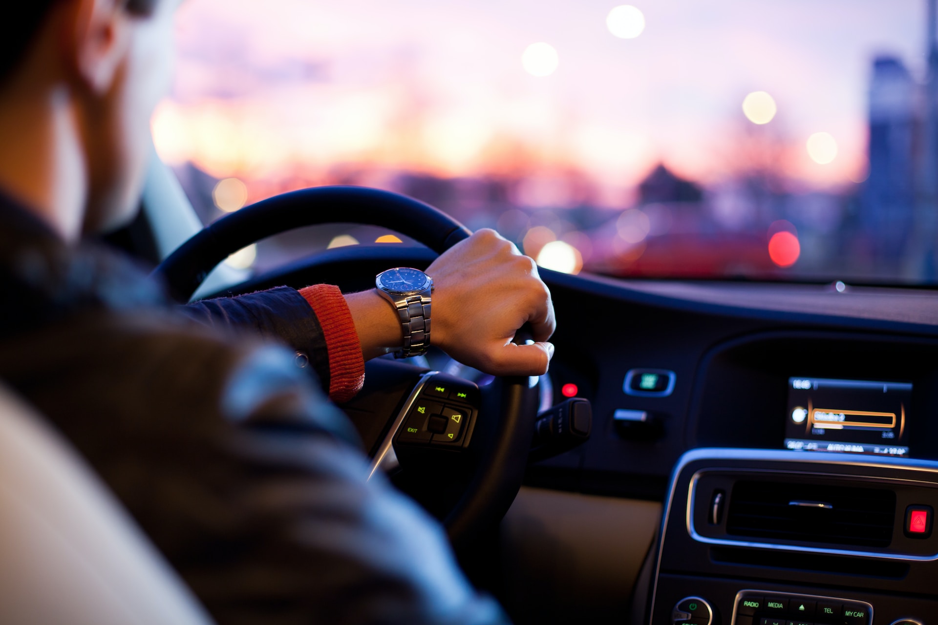 man driving a car